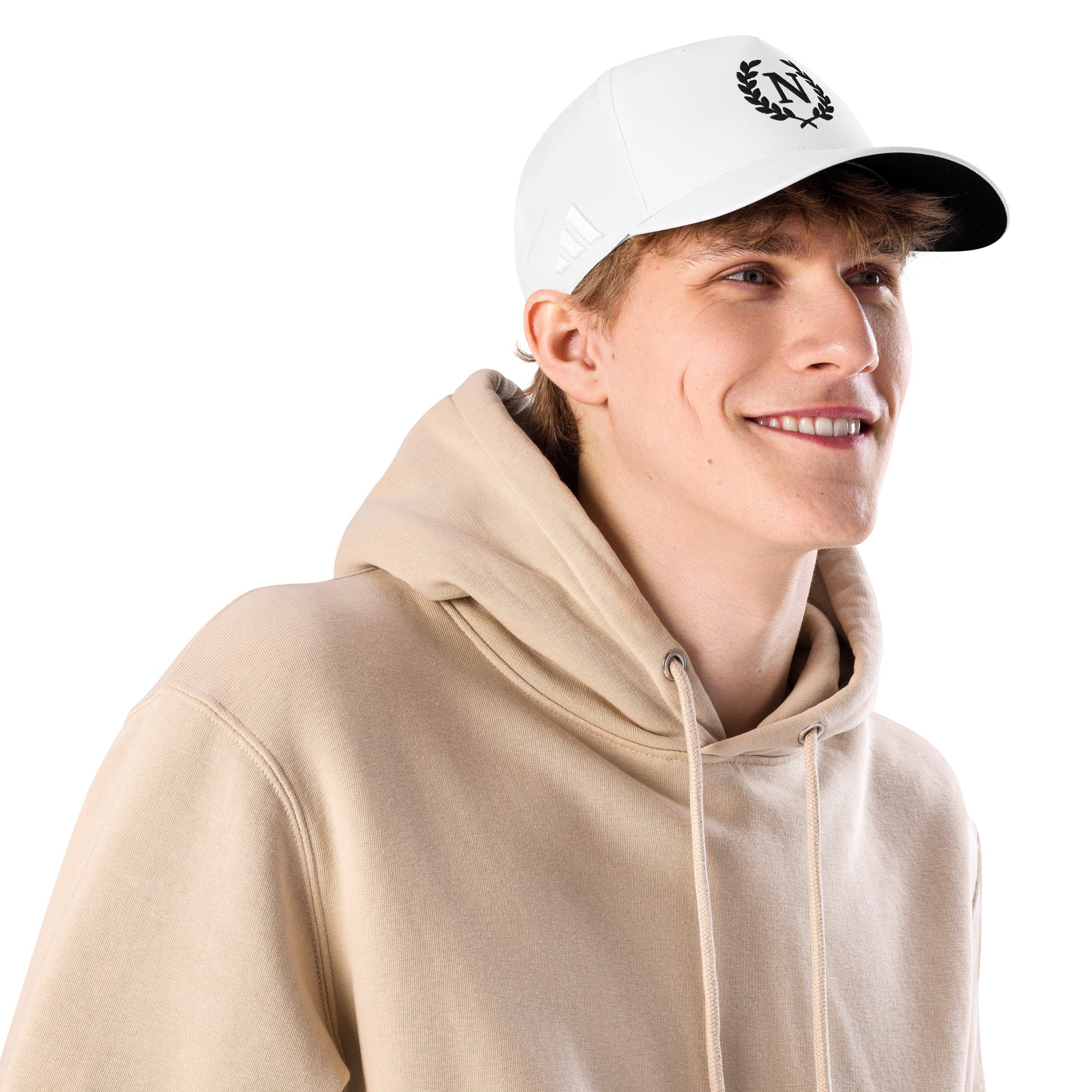 Person wearing a beige hoodie and white cap with a logo on a white from the historical background