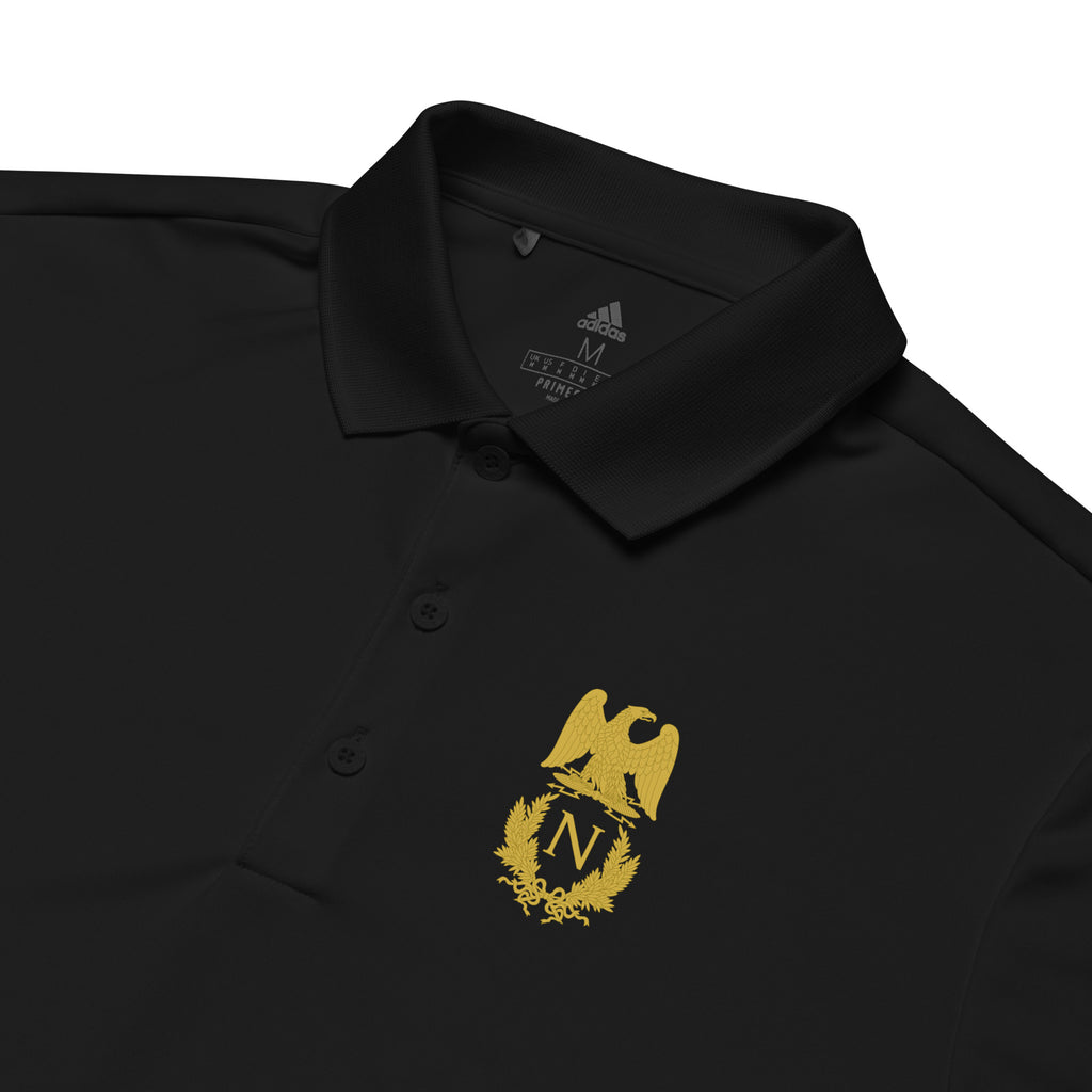 Black polo shirt with gold eagle emblem on a white background