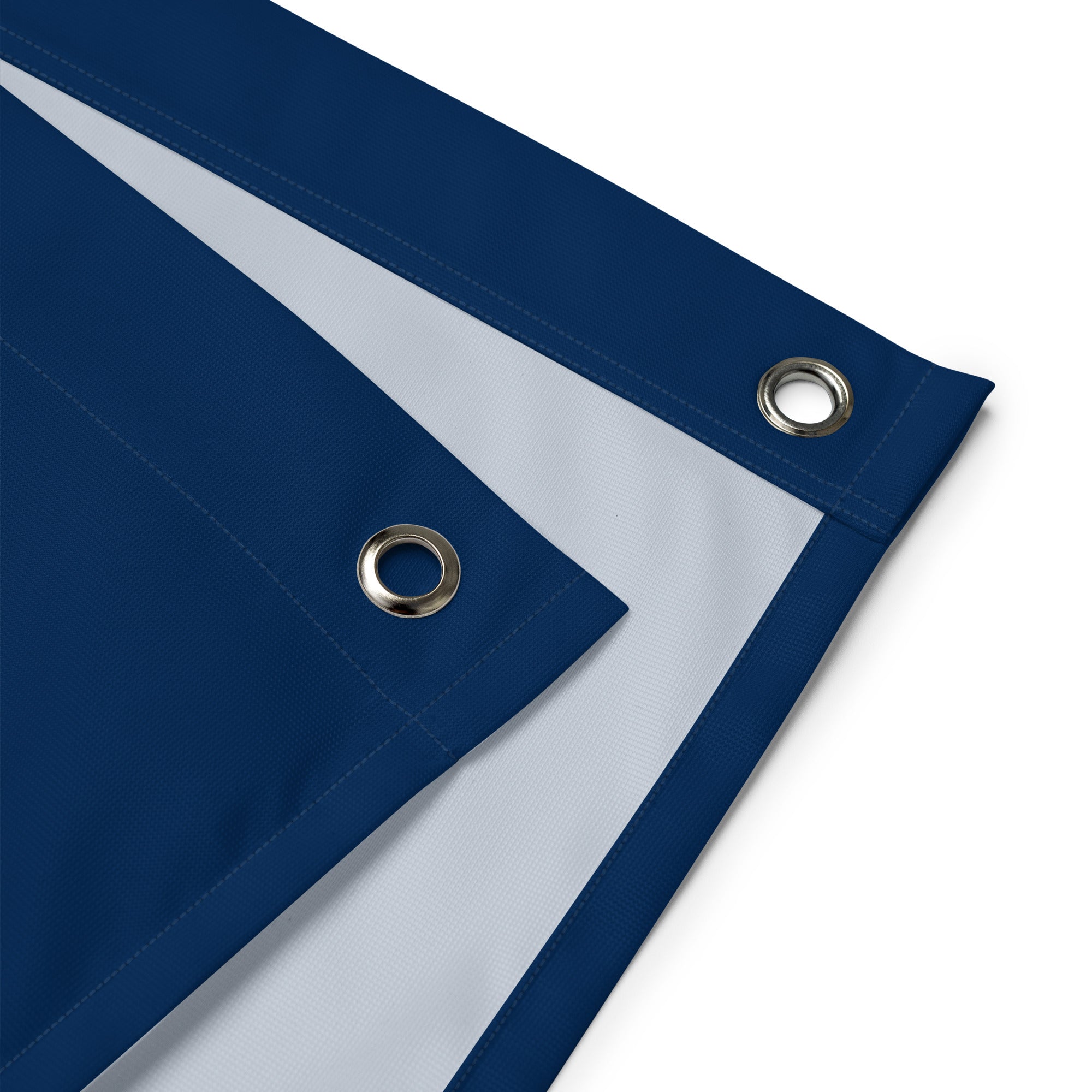 Close-up of a blue tarp with grommets on a white background with vintage heraldic