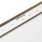 Close-up of a leather strap with a metal buckle on a white background