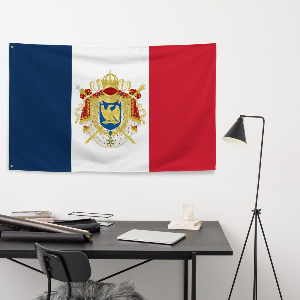 Flag with a coat of arms hanging on a wall above a desk. Study room with French vexillology