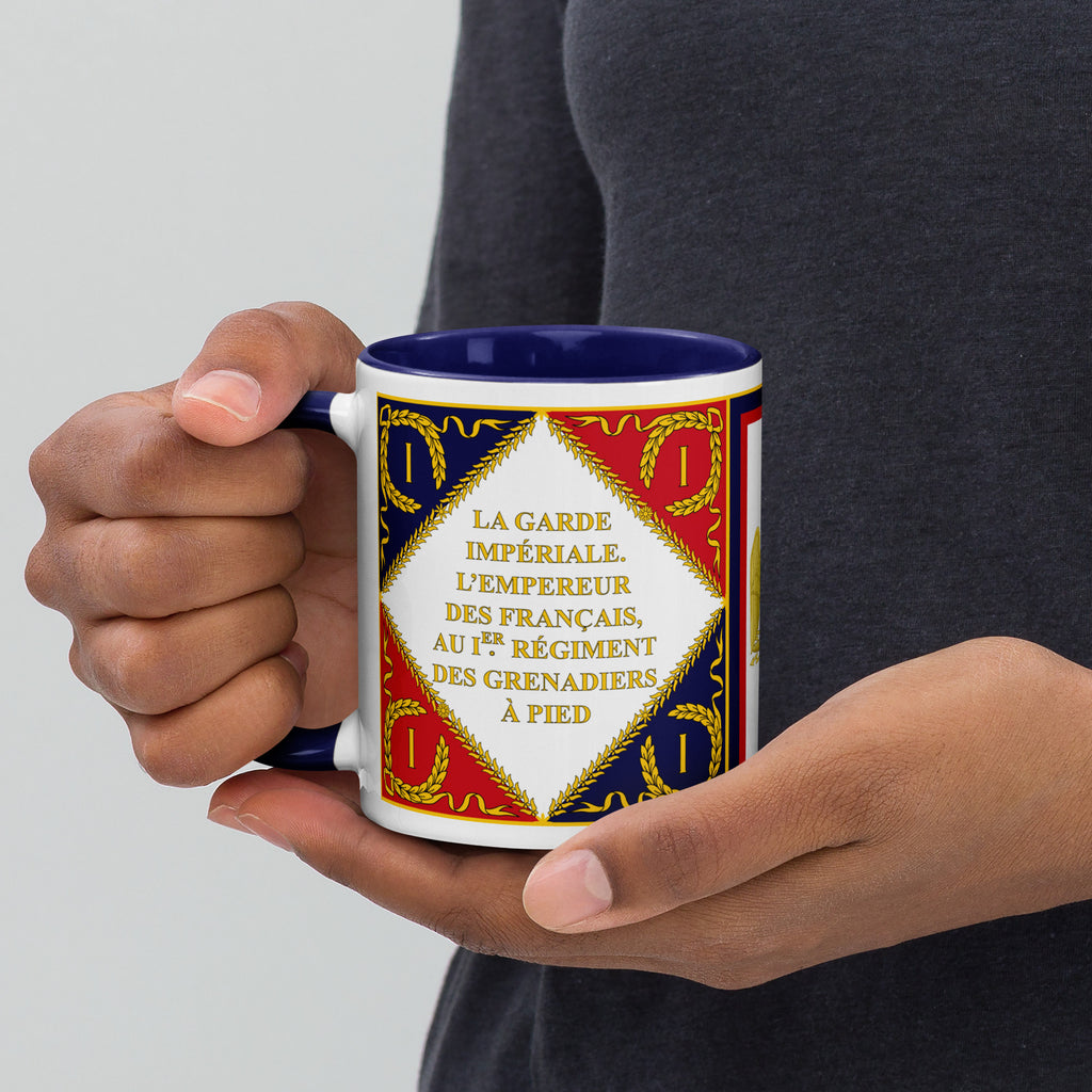 Man holds a mug that shows the imperial Guard Standard of the First French Empire