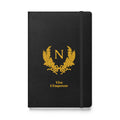 Black notebook with gold emblem and text on a white background