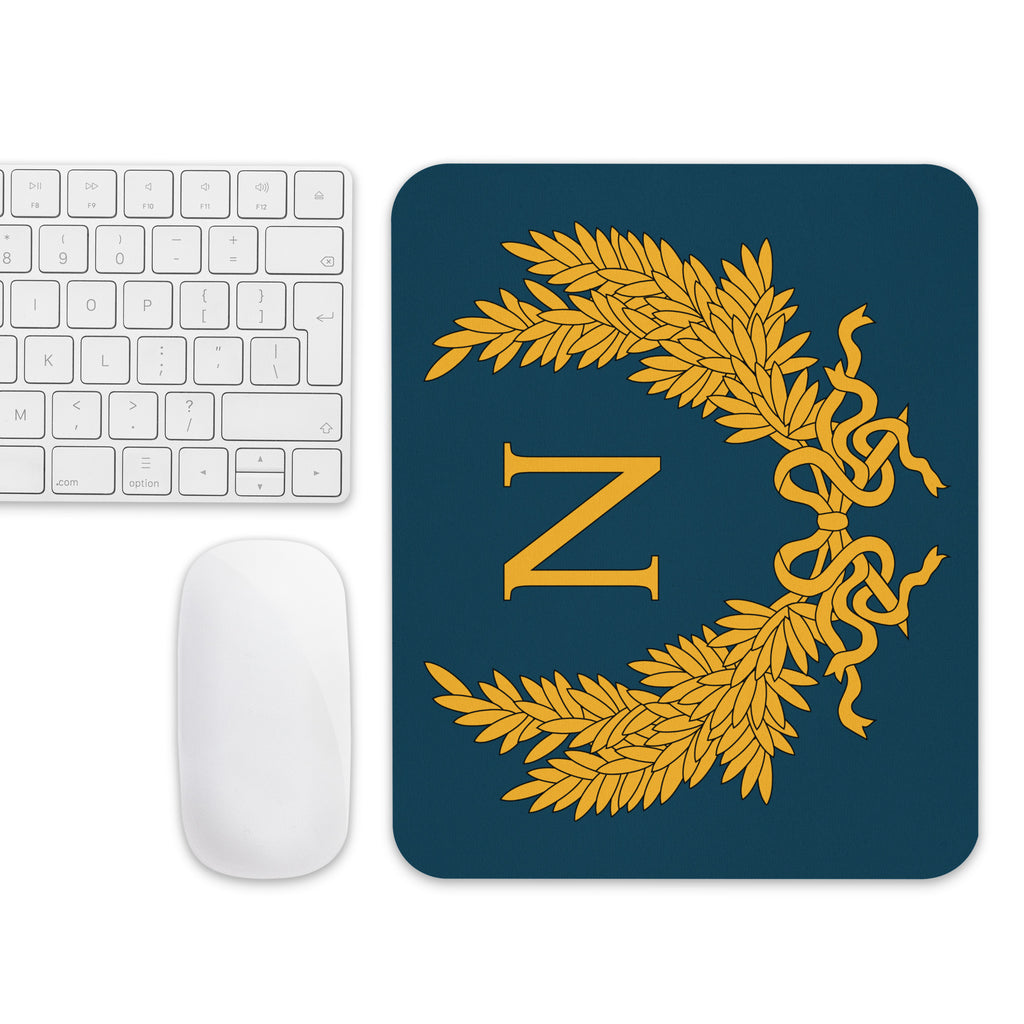 white apple mouse and apple keyboard next to a Napoleon Mouse pad to play Empire: Total War from Creative Assembly