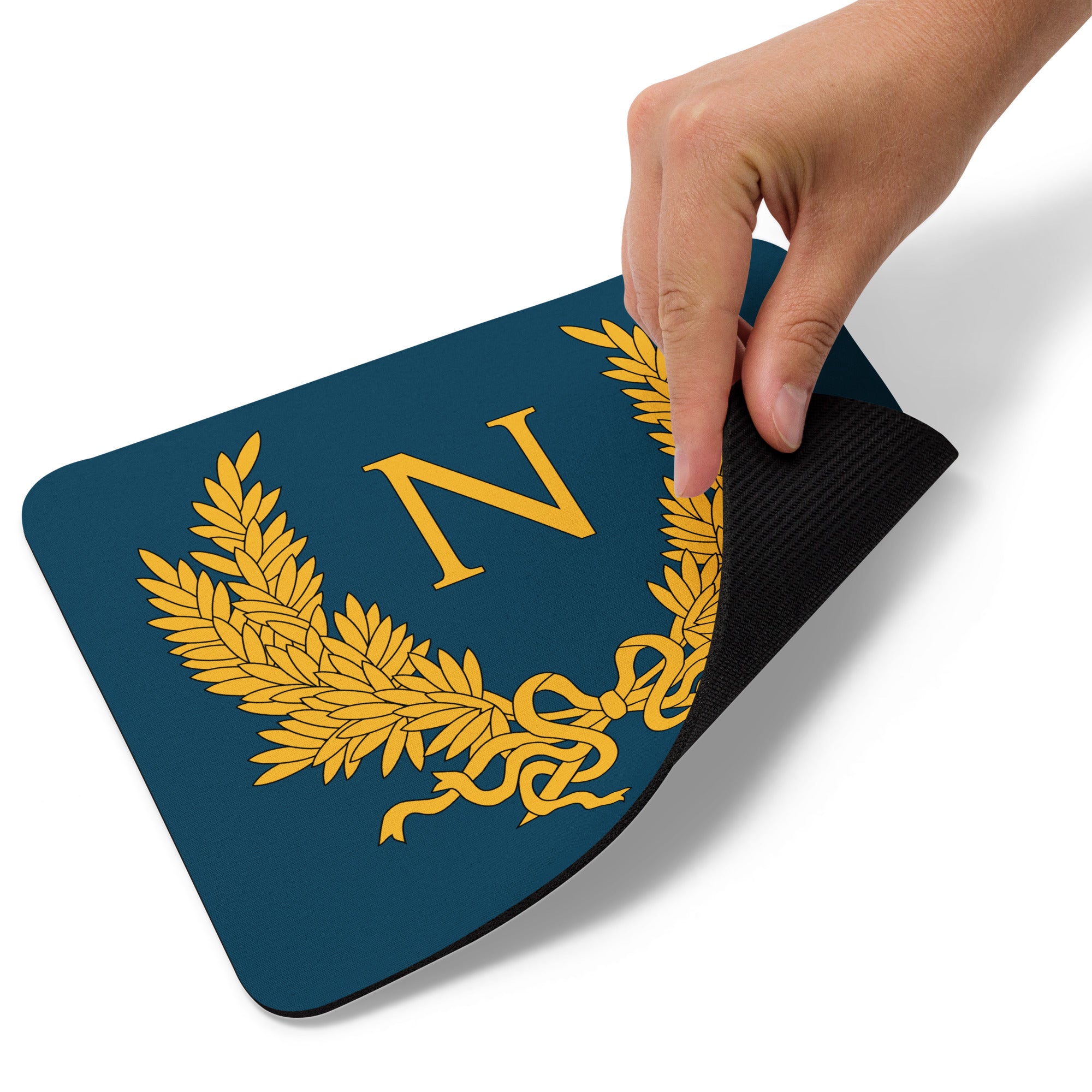 Hand pulls a Mouse Pad on which the N symbol of Napoleon is printed on