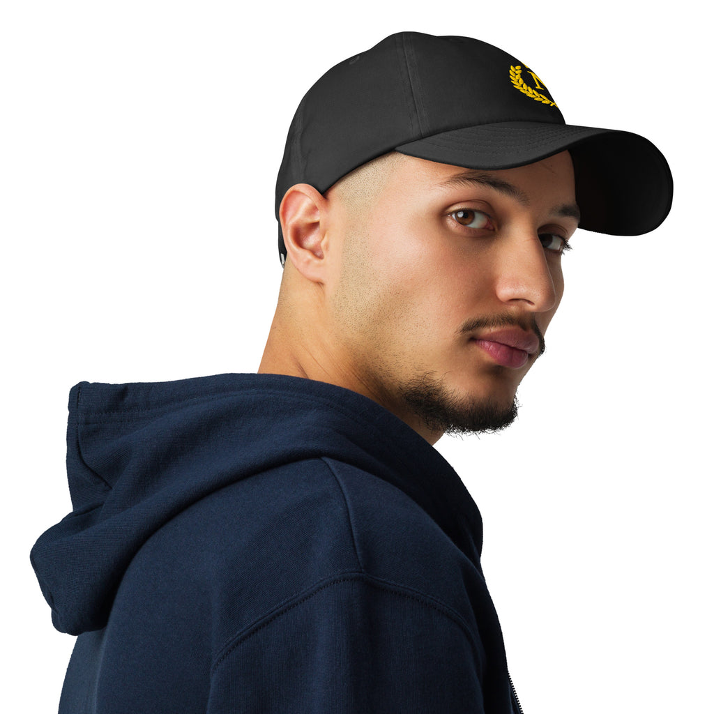 Man wearing a black cap with a red logo and a navy hoodie on a white background as souvenir